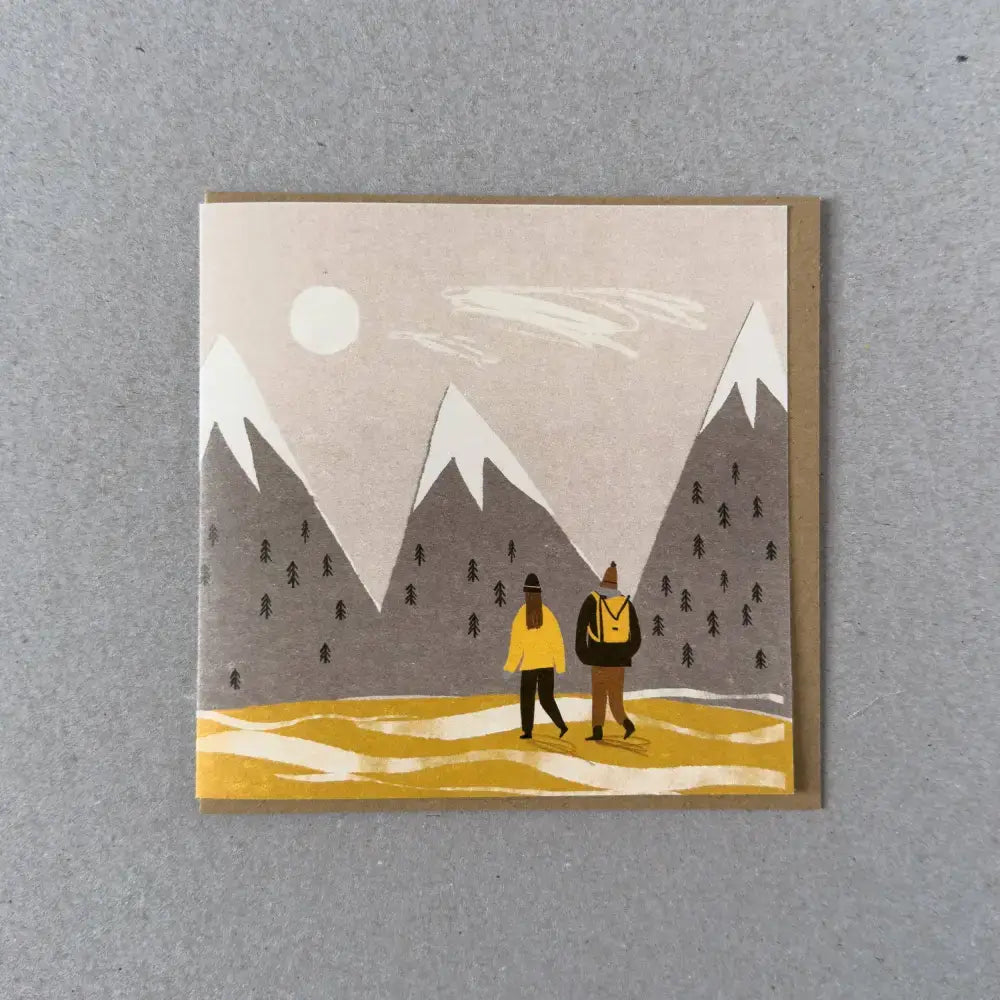 A scenic card illustration featuring two hikers against a backdrop of mountains and sun, perfect for any occasion.