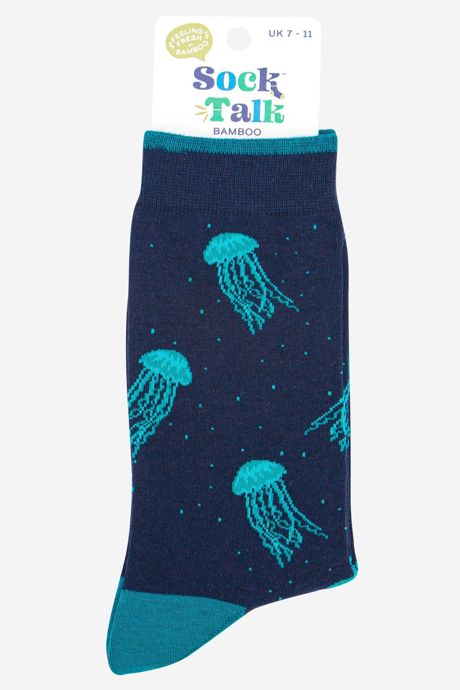 Navy sock with teal jellyfish pattern on a white background