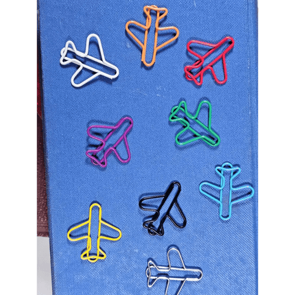 20 airplane shaped paper clips in a tin.
