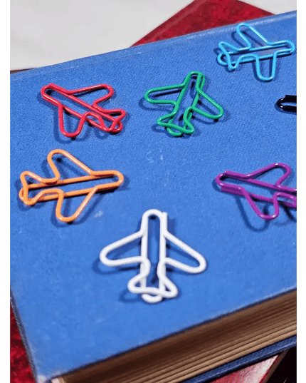 20 airplane shaped paper clips in a tin.