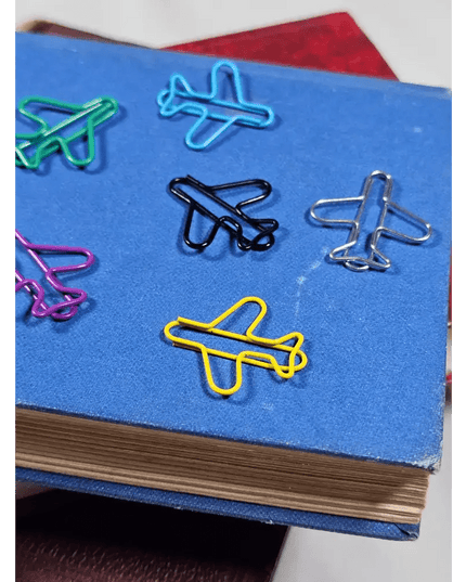 20 airplane shaped paper clips in a tin.