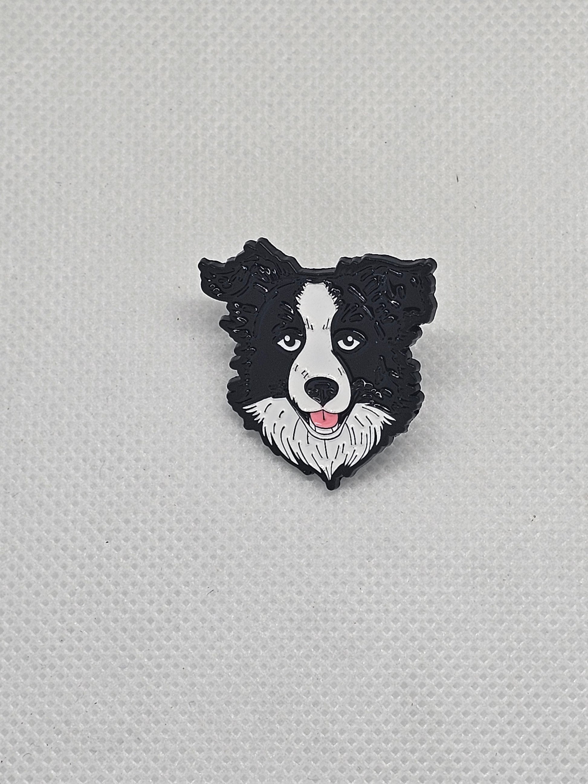 Black and white Border Collie enamel pin badge, perfect for dog lovers to accessorize clothing and bags.