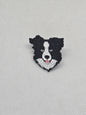 Black and white Border Collie enamel pin badge, perfect for dog lovers to accessorize clothing and bags.
