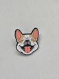 Smiling French Bulldog enamel pin badge, perfect for dog lovers to accessorize clothing and bags.