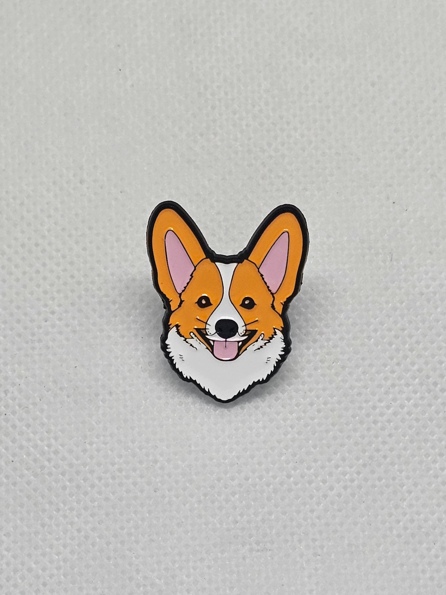 Corgi enamel pin badge with a happy expression, perfect for dog lovers to accessorize clothing or bags.