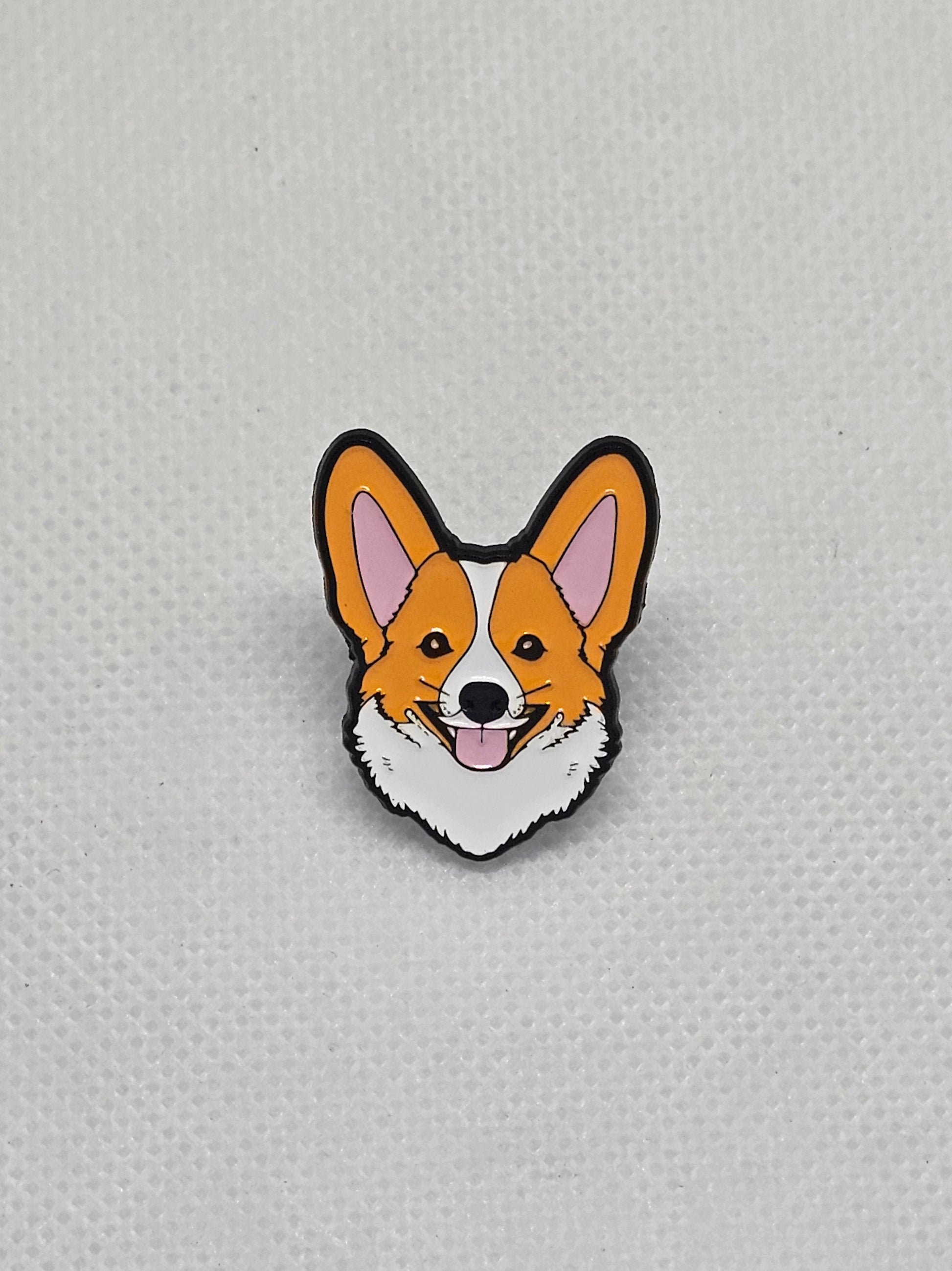 Corgi enamel pin badge with a happy expression, perfect for dog lovers to accessorize clothing or bags.