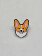 Corgi enamel pin badge with a happy expression, perfect for dog lovers to accessorize clothing or bags.