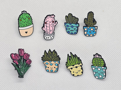 Colorful enamel pin badges featuring cute cacti and flowers in pots, perfect for accessories or gifts.