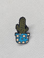 Cactus pin badge in a blue pot with white polka dots, perfect for backpacks or jackets.