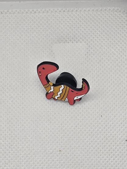 Cute red dinosaur pin badge with a colorful design, perfect for clothing or bag accessories.