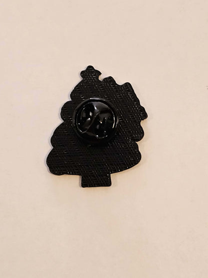 Black decorative pin on a beige background