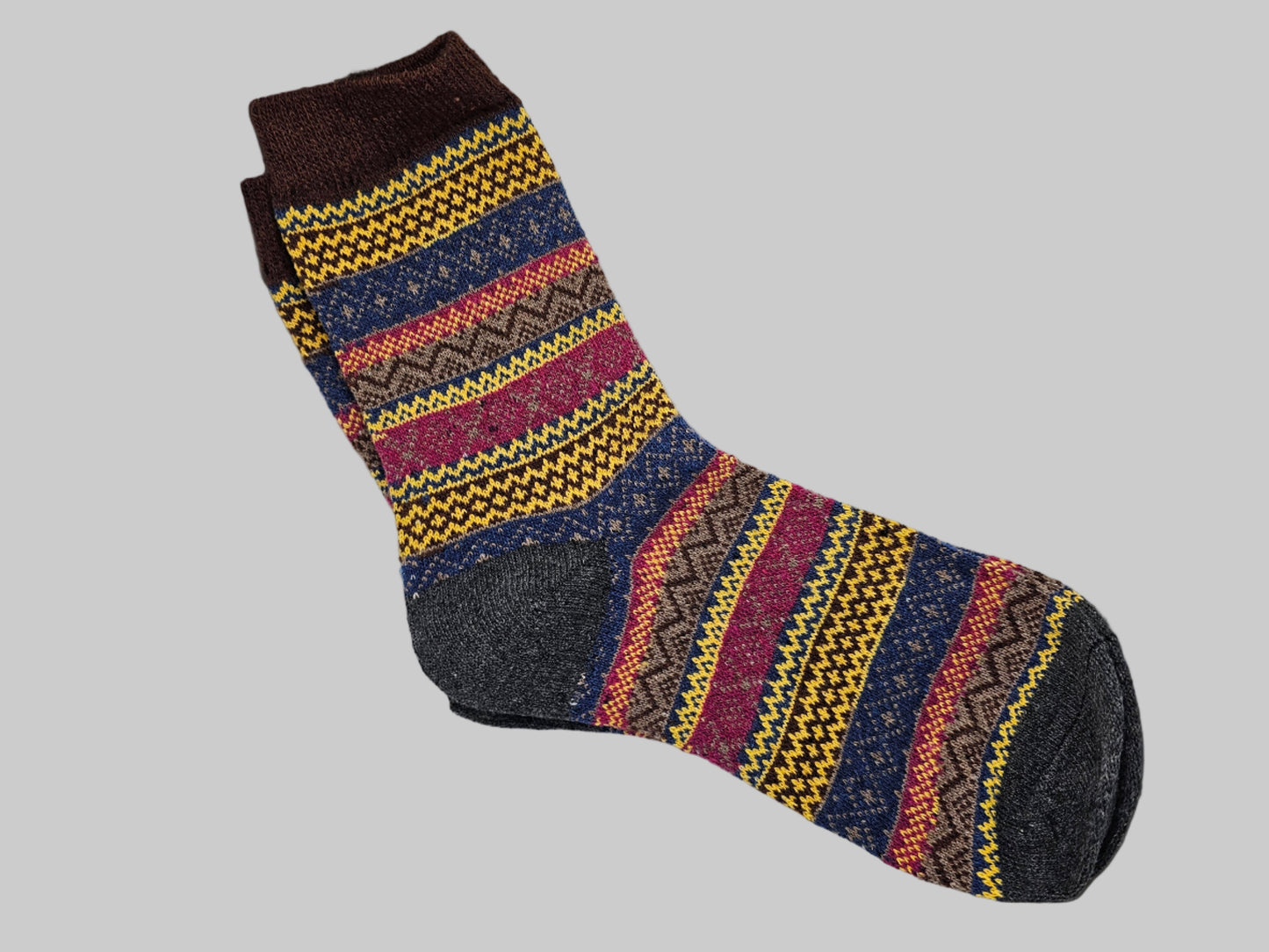 Multicolored patterned sock on a white background