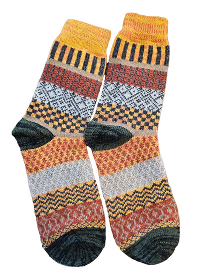 Set of patterned socks on a wooden surface