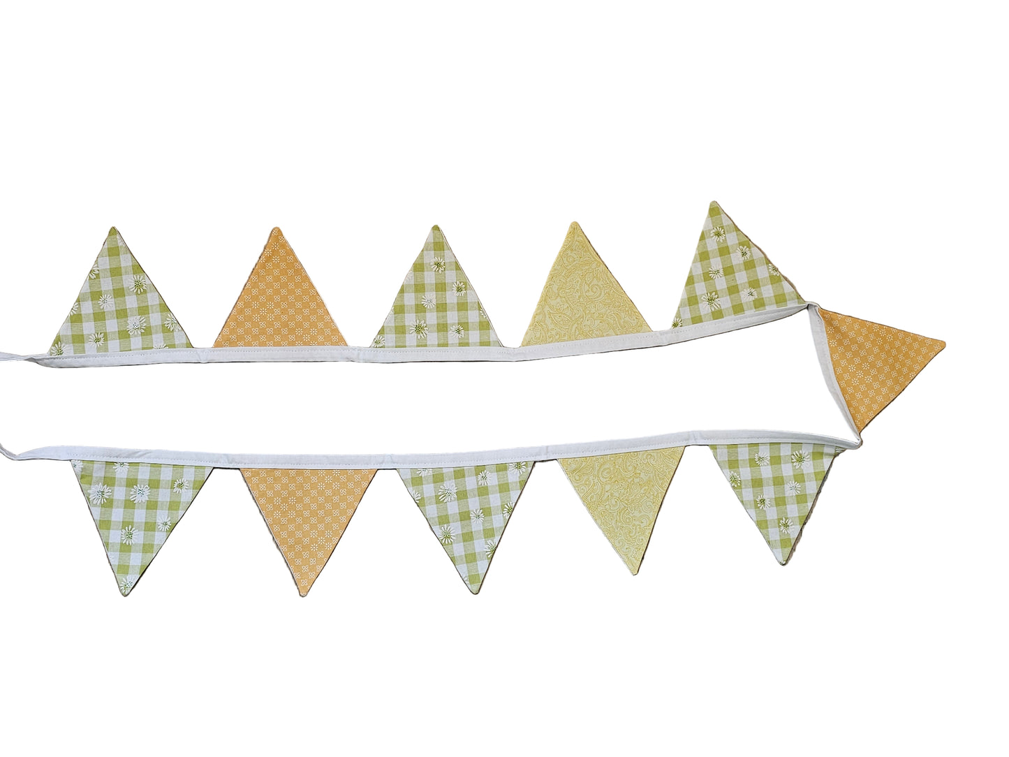Fabric banner with checkered and solid triangles on a wooden surface