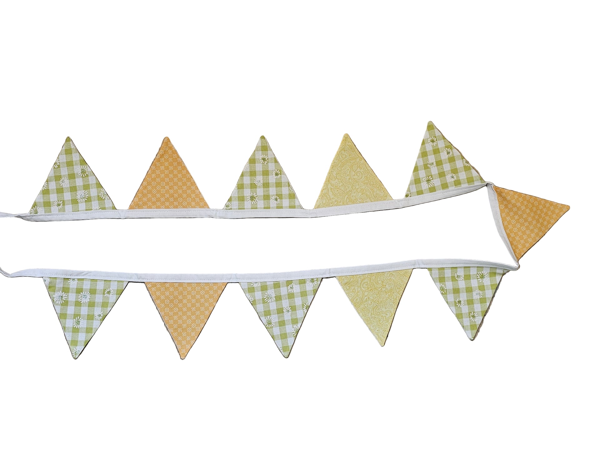 Fabric banner with checkered and solid triangles on a wooden surface