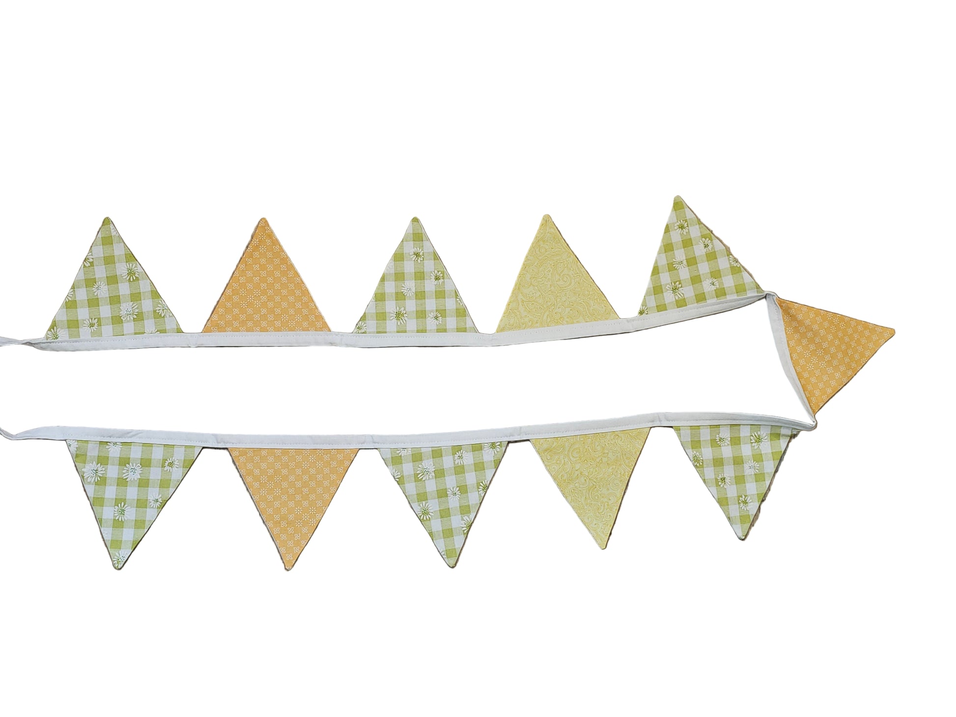 Fabric triangle banner with green and yellow checkered pattern on a wooden surface