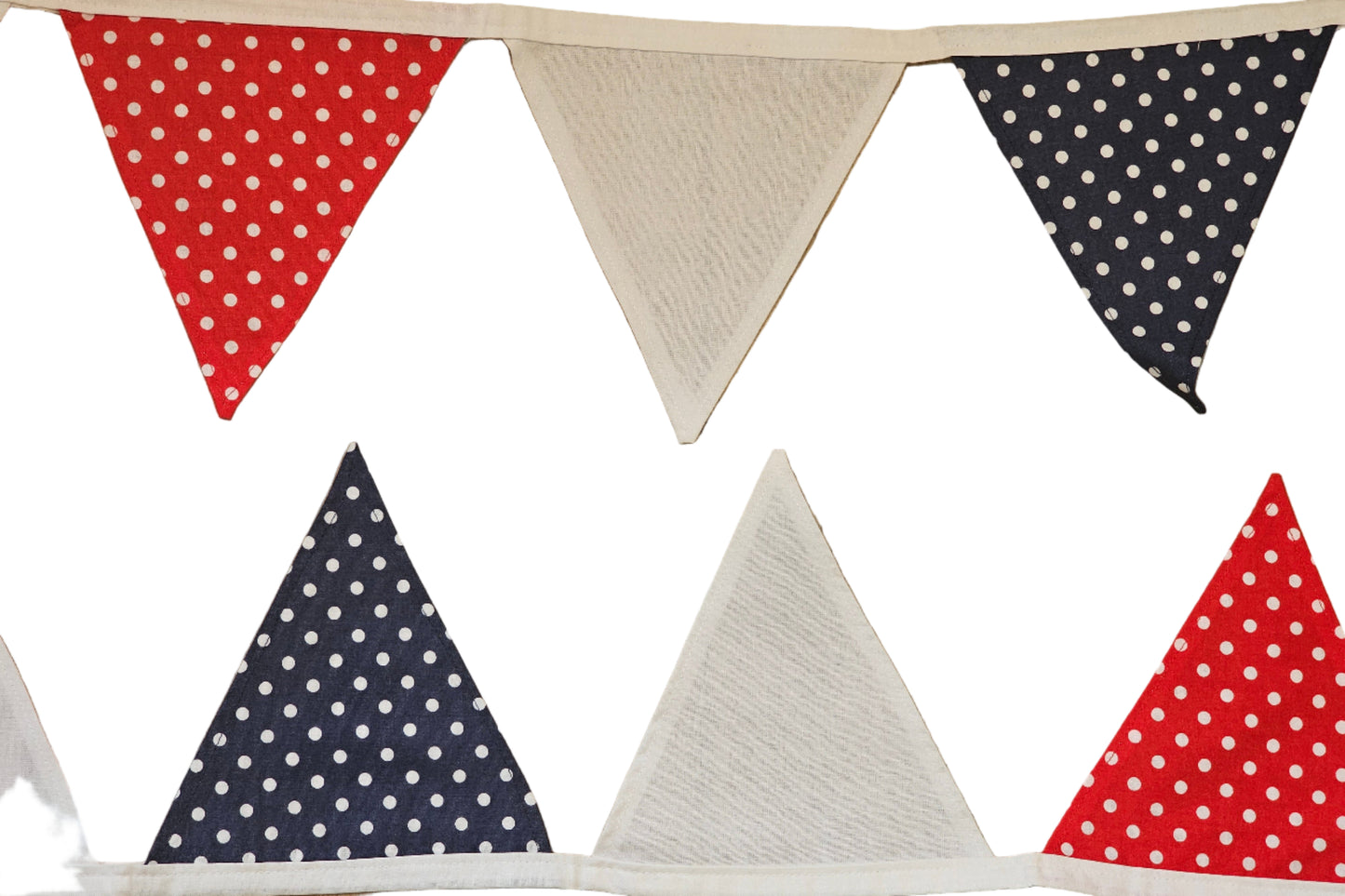 Triangular flags with red, white, and blue patterns on a wooden background