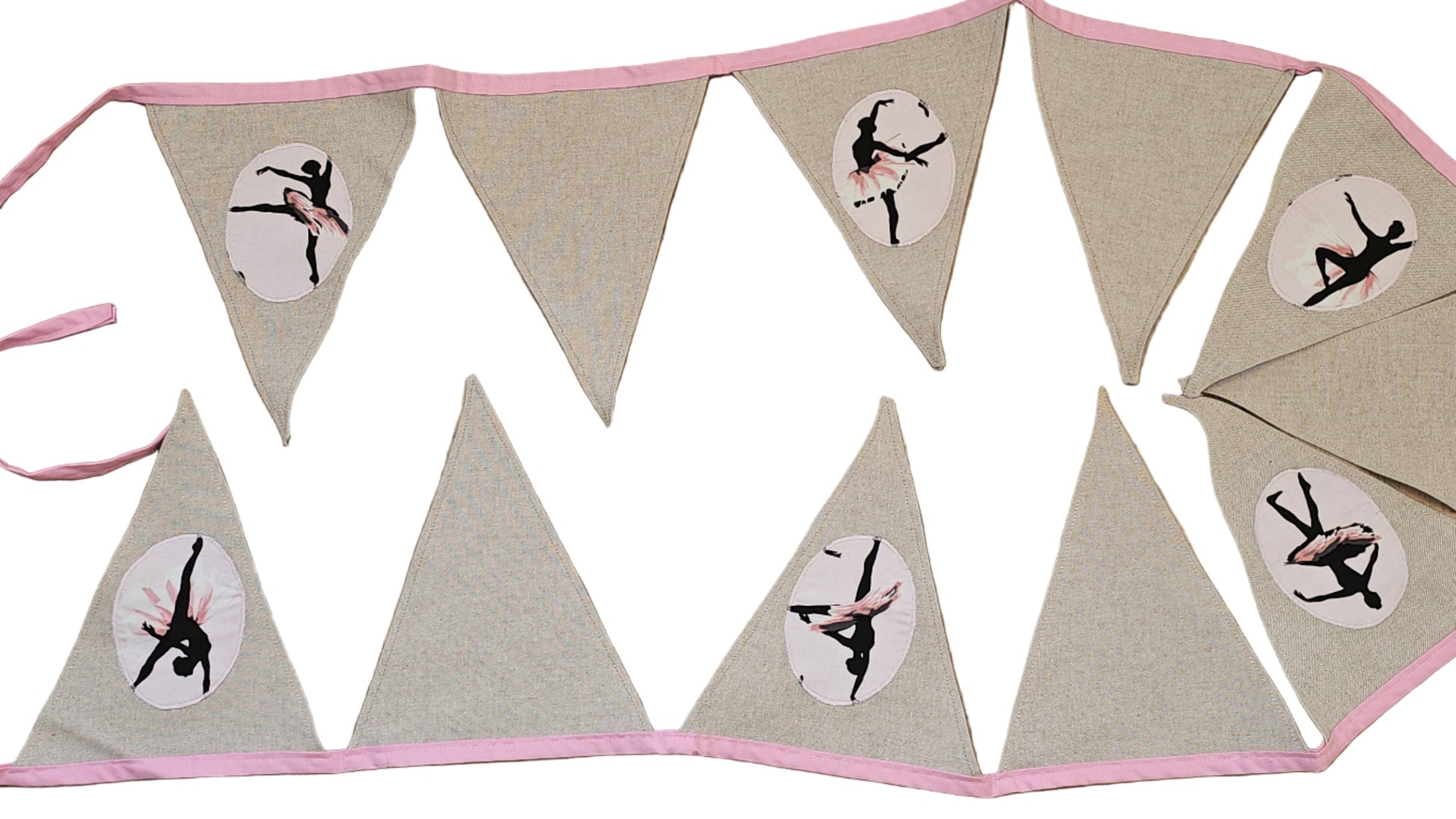 Bunting flag with a ballerina design on a wooden surface