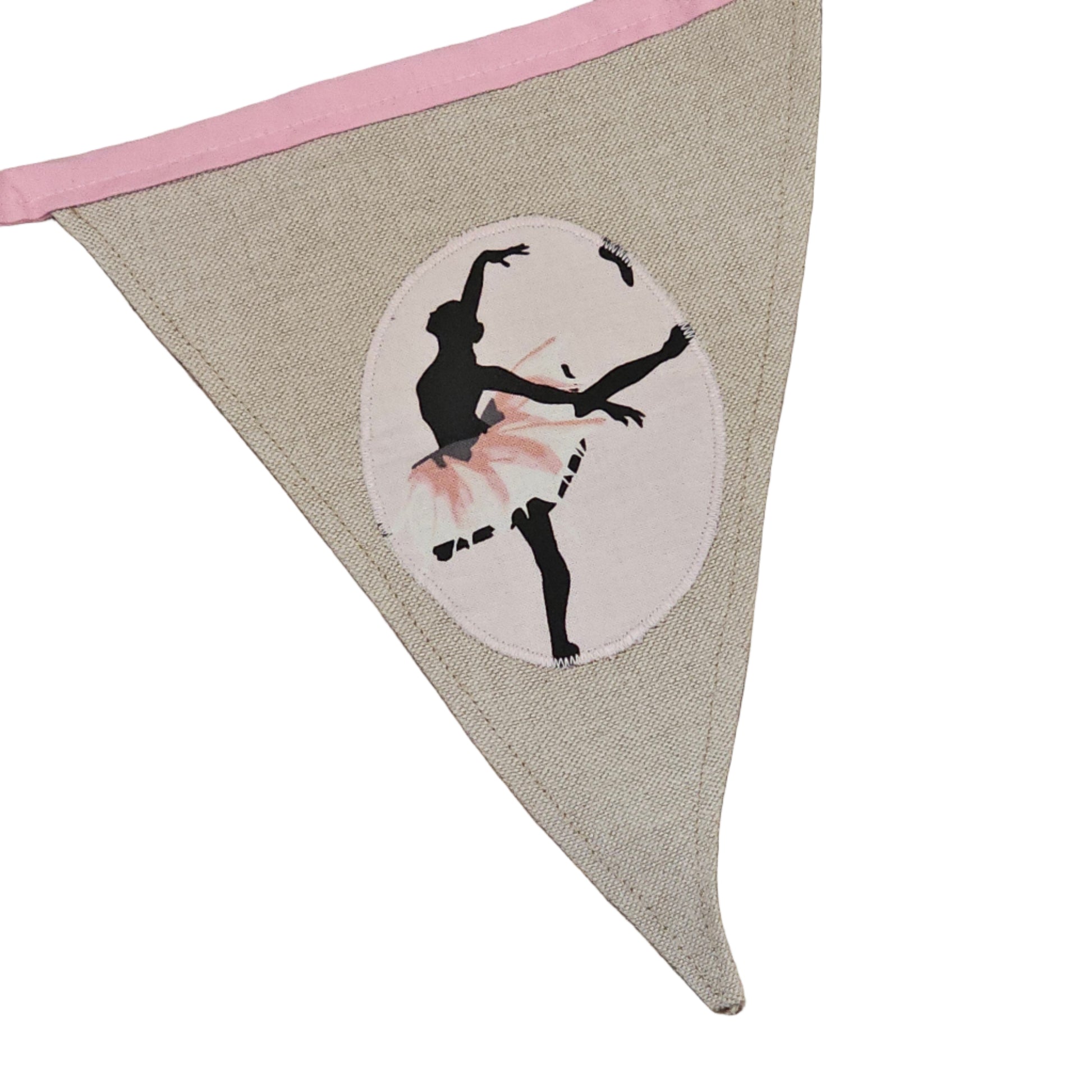 Bunting flag with a ballerina design on a wooden surface