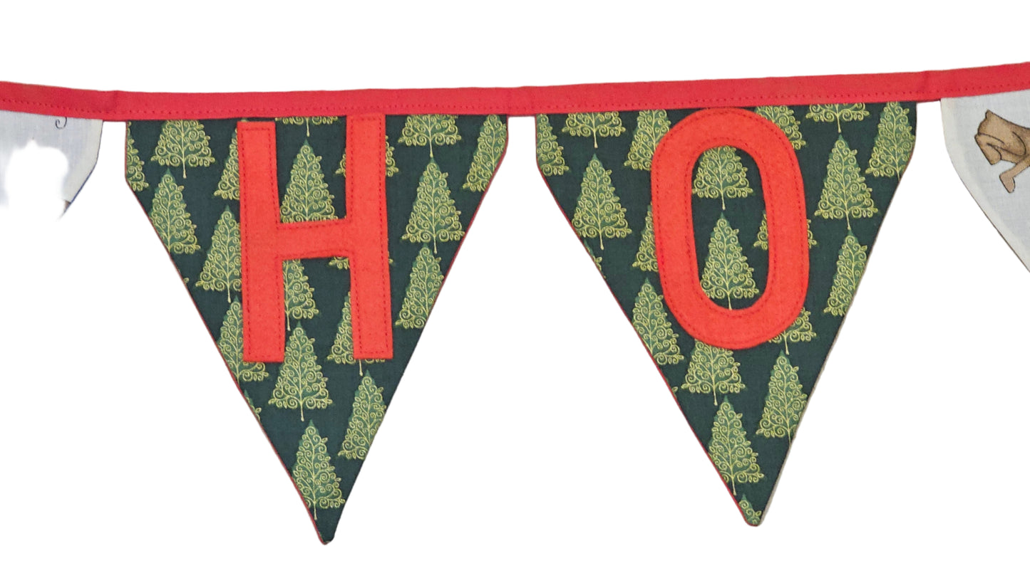 Decorative banner with 'HO' letters on a wooden surface