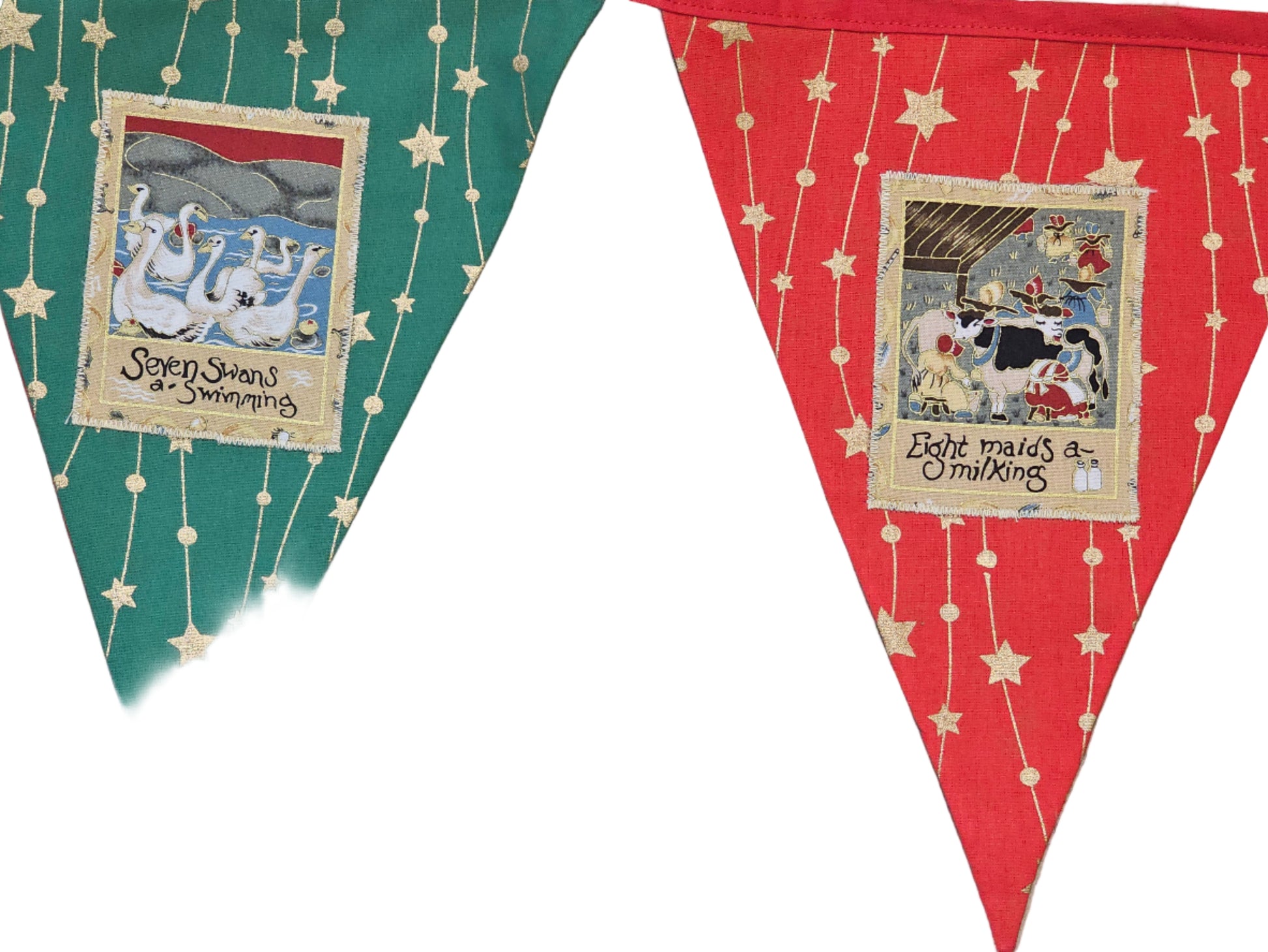 Two triangular fabric flags with illustrations and text on a wooden surface.