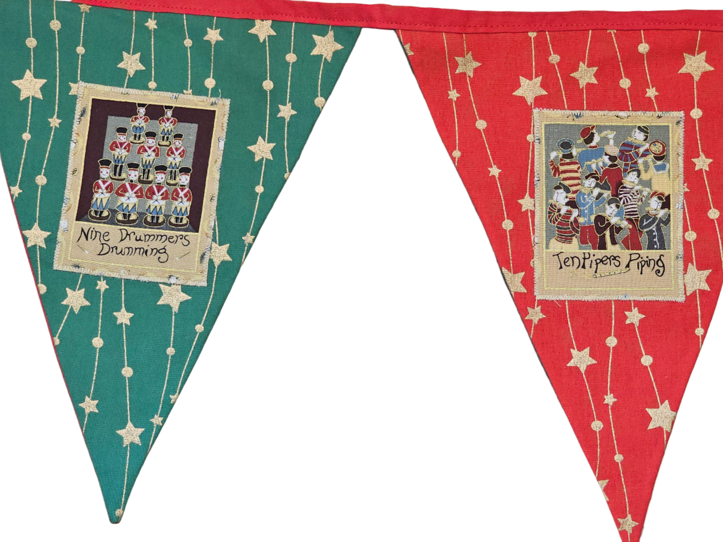 Decorative pennant banner with festive designs and text on a wooden surface.