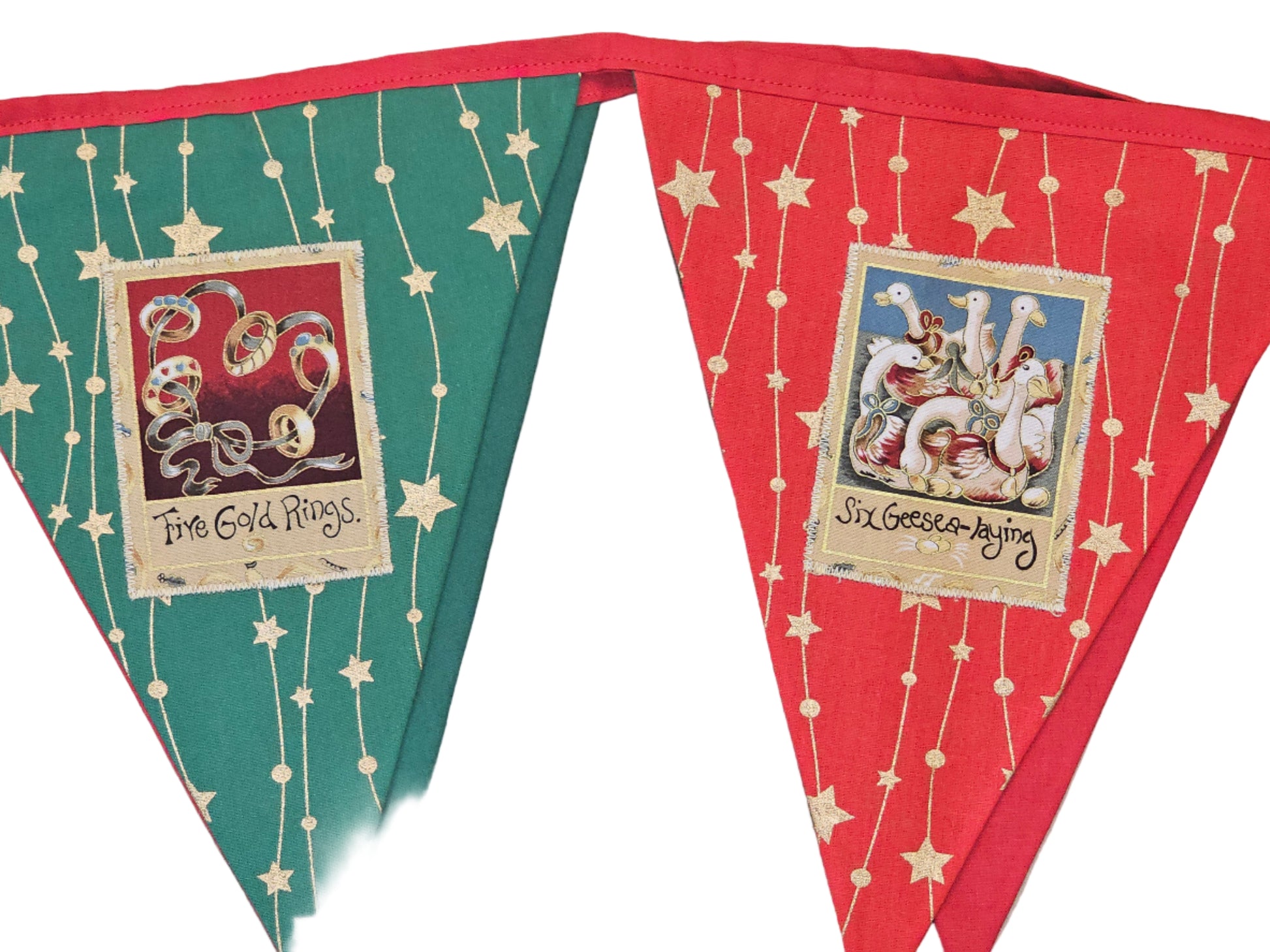 Decorative bunting with festive designs and text on a wooden surface
