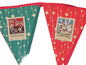 Decorative bunting with festive designs and text on a wooden surface