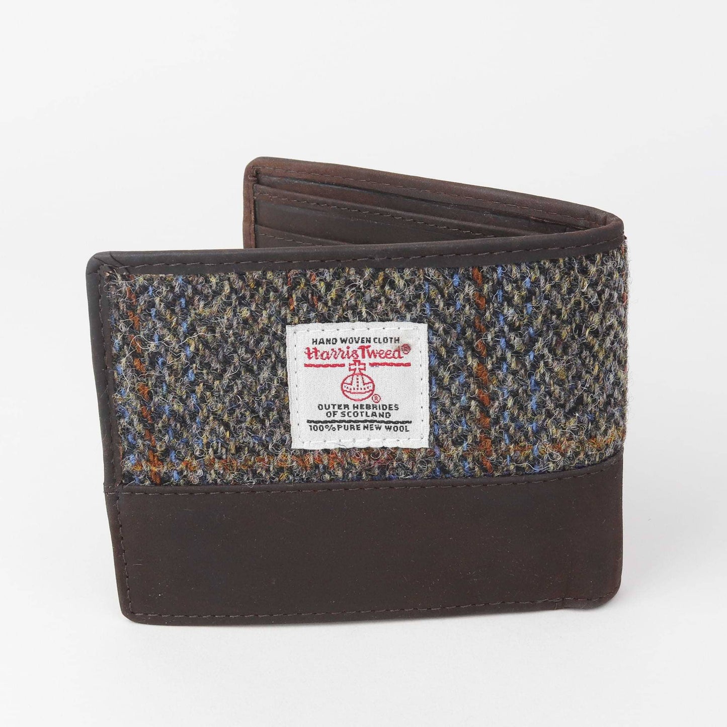 Harris Tweed wallet with checkered pattern and brand label on a white background