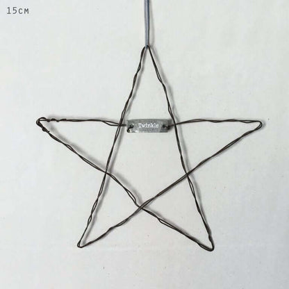 Star-shaped wire ornament with 'Twinkle' label on a white background