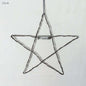 Star-shaped wire ornament with 'Twinkle' label on a white background