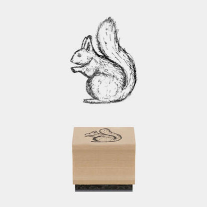 Wooden stamp with a squirrel design on a white background