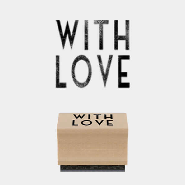 Wooden block with 'WITH LOVE' text on a white background
