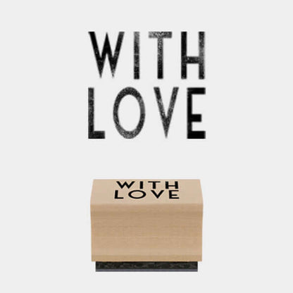 Wooden block with 'WITH LOVE' text on a white background