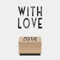 Wooden block with 'WITH LOVE' text on a white background