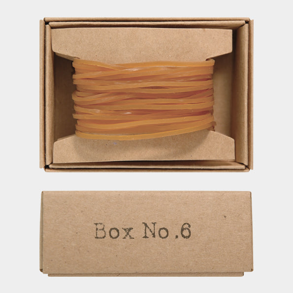 Brown rubber band box with 'Box No.6' label on a white background