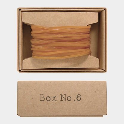 Brown rubber band box with 'Box No.6' label on a white background