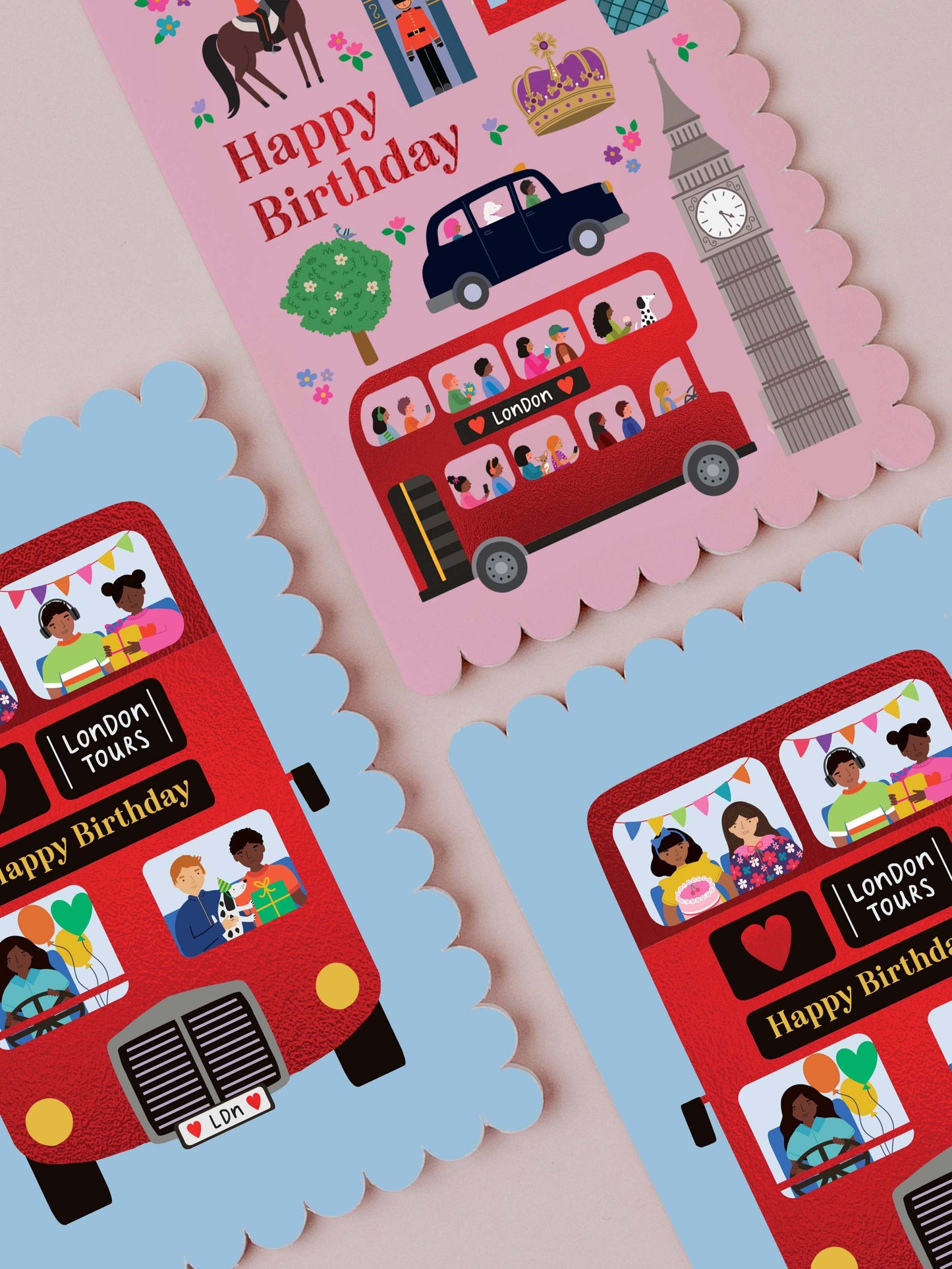 Three birthday cards featuring red London buses and 'Happy Birthday' text on a pink, blue, and multicolor background.