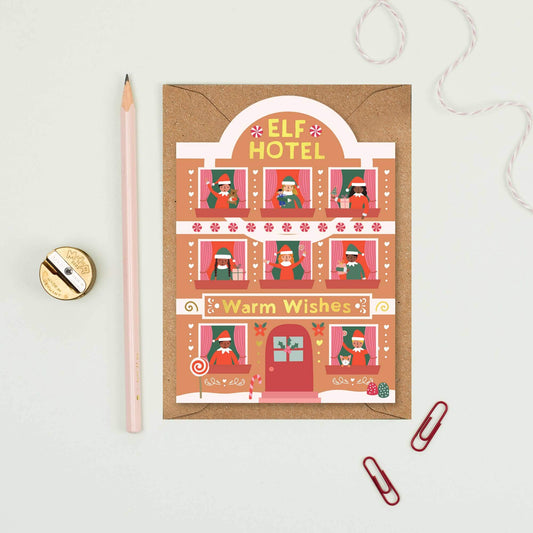 Christmas card with 'Elf Hotel' design on a light gray background