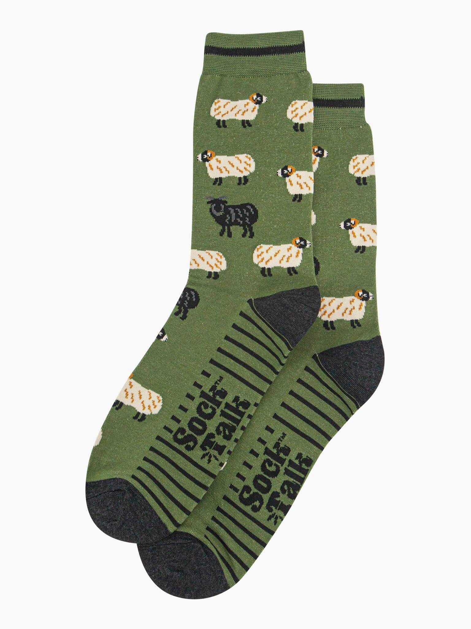 Green socks with sheep pattern on a white background