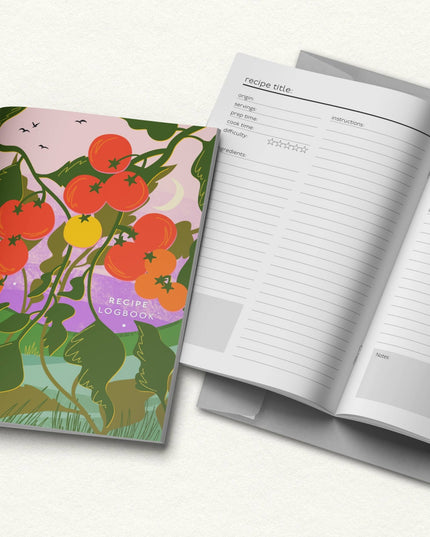 Recipe logbook with tomato-themed cover and open pages on a white background