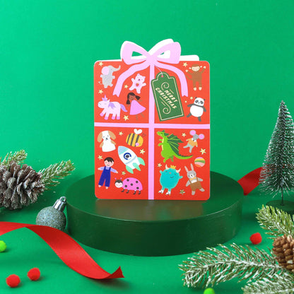 Colorful gift box with cartoon illustrations on a green background
