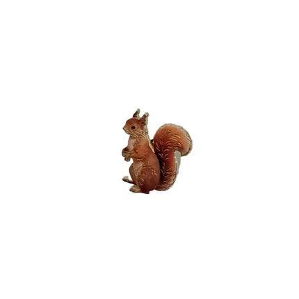 Small squirrel pin on a light gray background