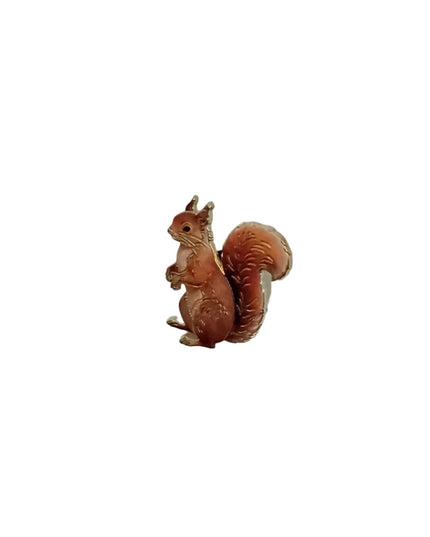Small squirrel pin on a light gray background