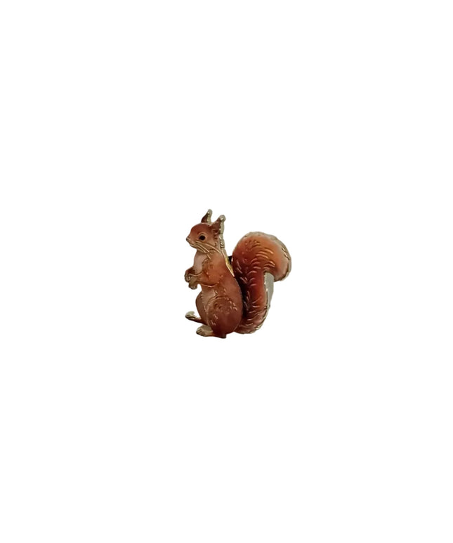 Small squirrel pin on a light gray background