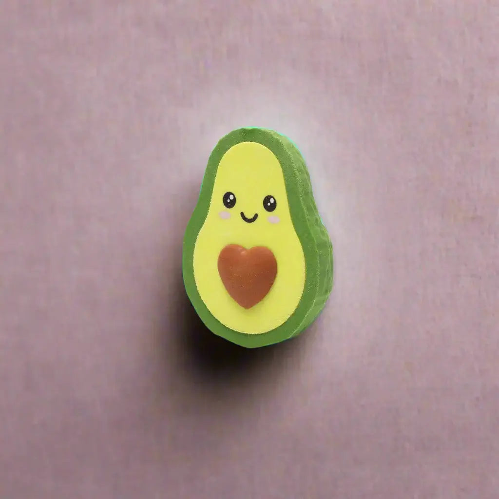 Avocado-shaped eraser with a smiling face and red heart on a white background