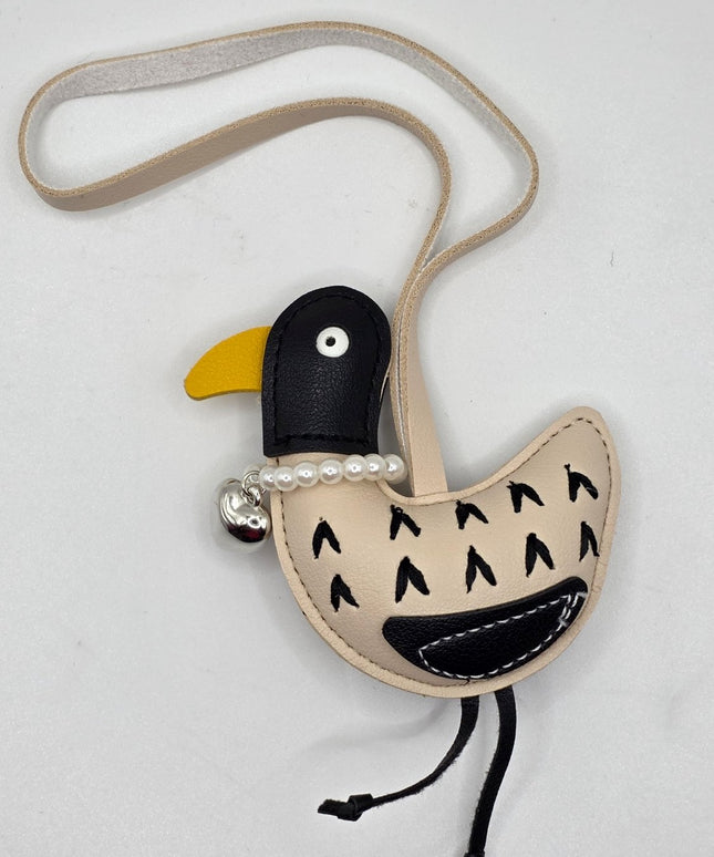 A bird shaped bag charm