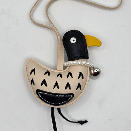 a bird bag charm