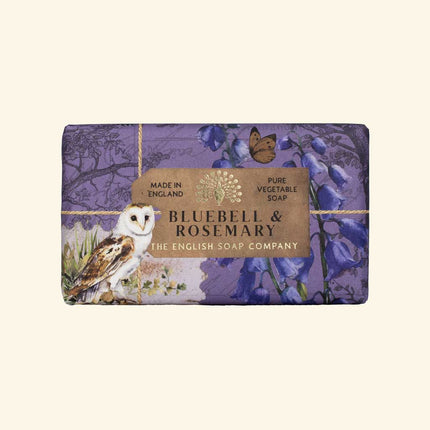 Soap bar with 'Bluebell & Rosemary' packaging featuring an owl and flowers on a beige background