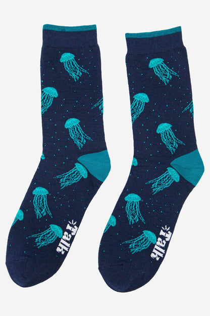 Navy blue socks with teal jellyfish pattern on a white background